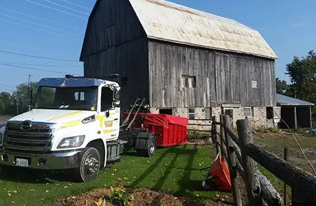 Load-N-Lift waste removal bin on job site Ontario